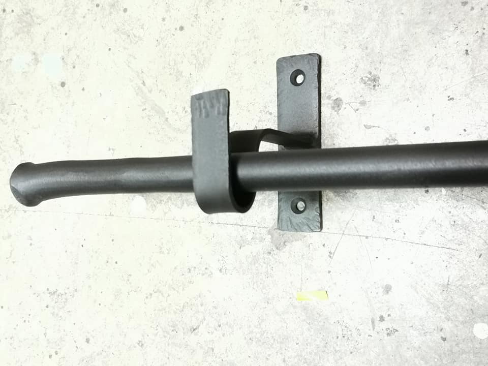 a black pipe on a concrete surface