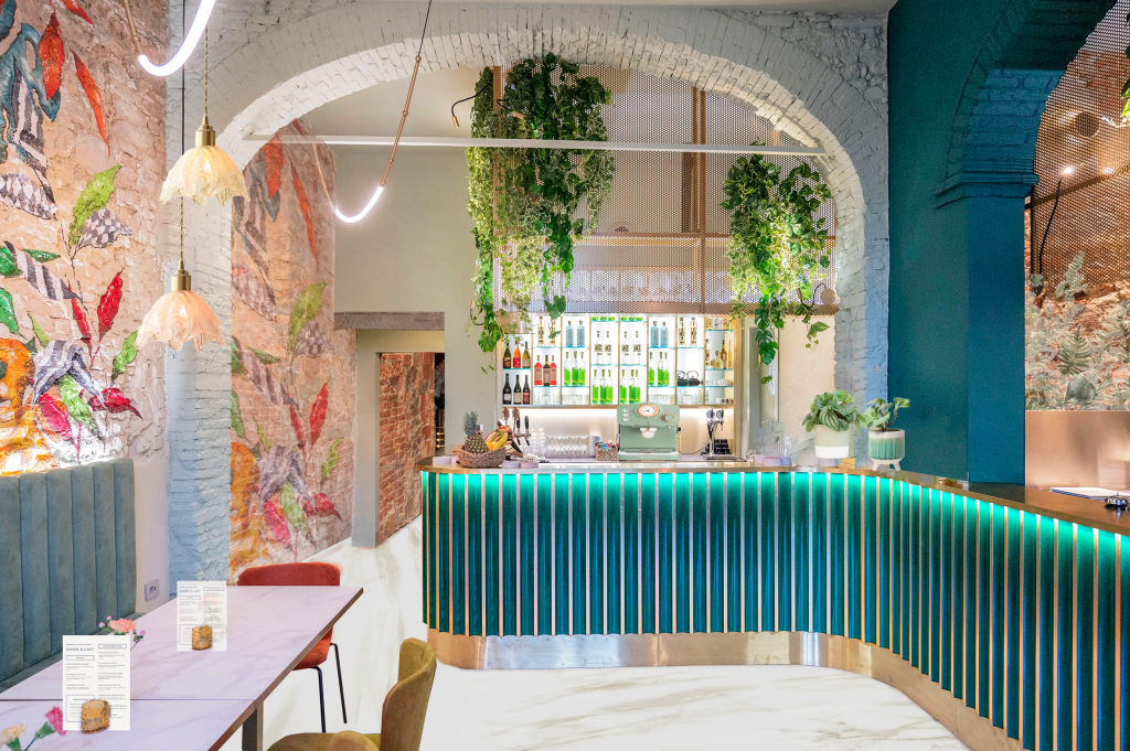 a bar with plants from the ceiling